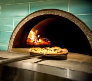 Pizza in wood-fired oven at Milo and Olive