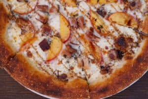 Bacon & nectarine pizza at Milo & Olive